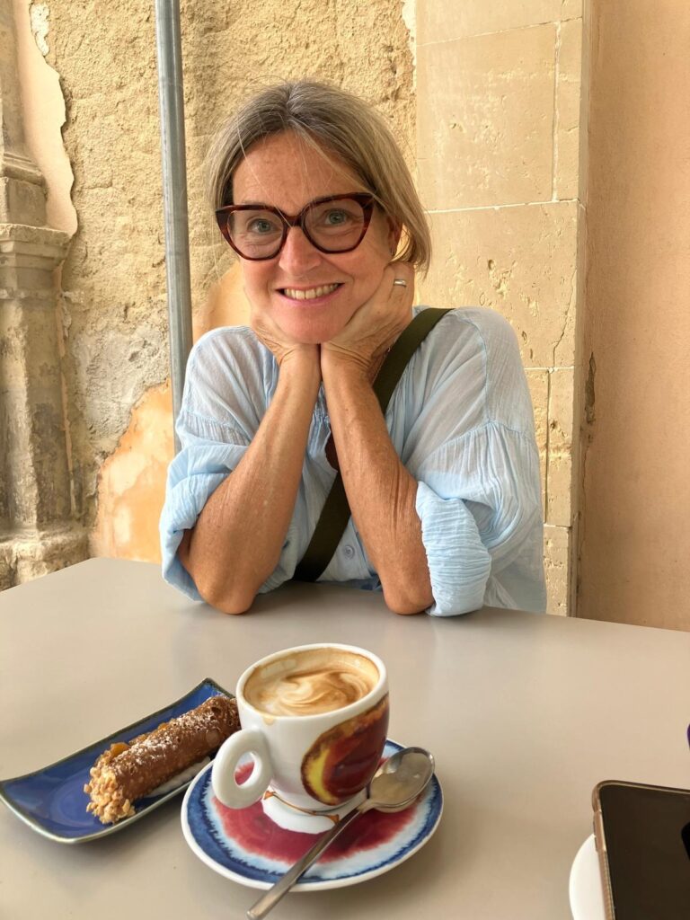 Woman with coffee and pastry